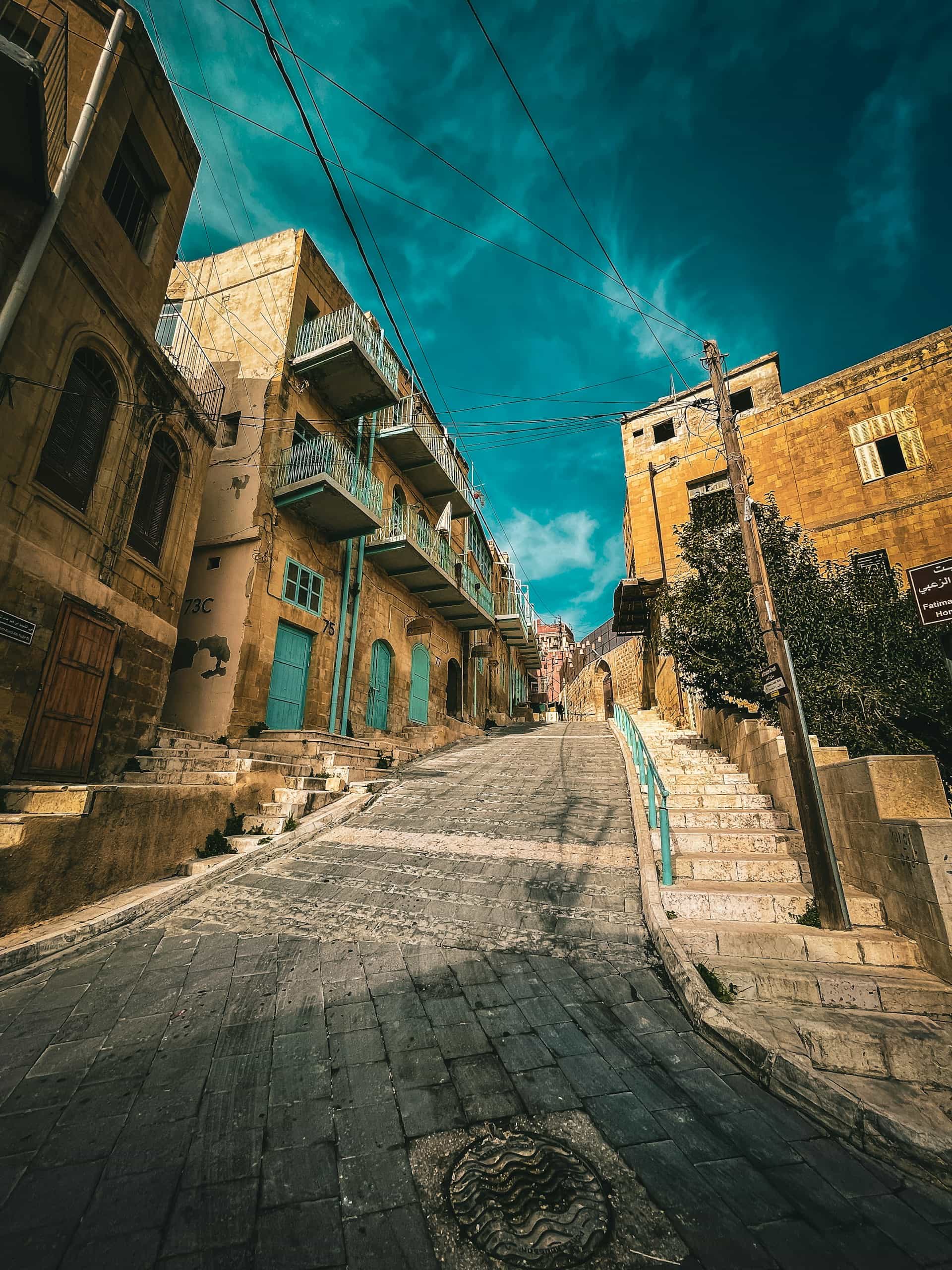 Stone buildings and shopfronts along Al-Khader Street in As-Salt.